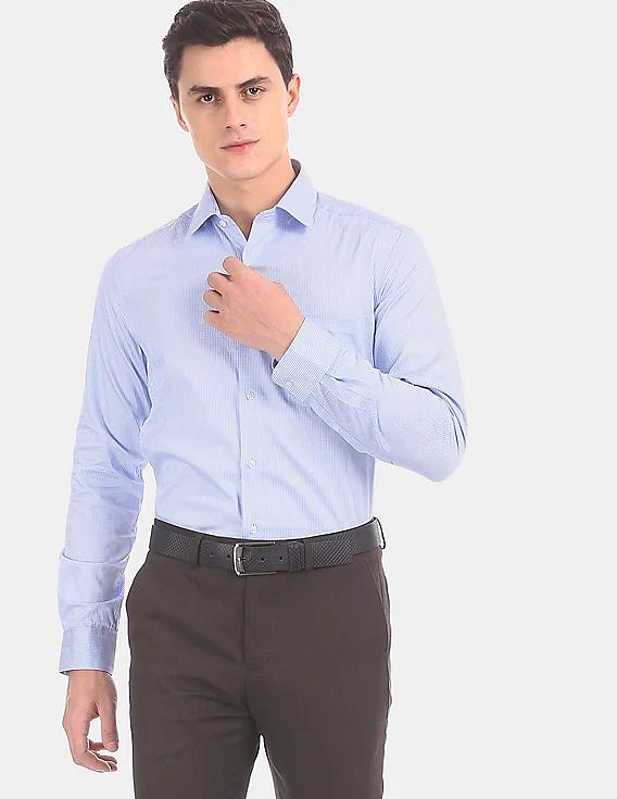 A male model showcasing appropriate clothing for a job interview, including a classic shirt and trousers.